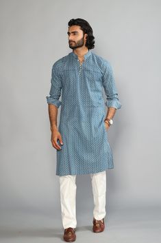 This is a bespoke product, specially crafted for you.  Crafted in Chinese Collar and Full Sleeves Available with a Cotton Pajama in White, It has a hand-block printed design all over it which makes it best outfit for your Wedding Function, Diwali, Eid, Durga Pooja and Cocktail Parties. Do note: Footwear shown in the image are also made to order and can be added separately, but it takes 15 days processing time.  (Slight variation in actual color vs. image is possible) Cotton Block Print Wedding Sets, Wedding Cotton Sets With Block Print, Wedding Cotton Block Print Sets, Blue Cotton Sets With Cutdana Detail, Blue Cotton Sets With Cutdana, Blue Block Print Sets For Eid, Indigo Cotton Sets With Dabka Detailing, Blue Block Print Long Sleeve Kurta, Traditional Wedding Wear With Bandhani Print In Cotton