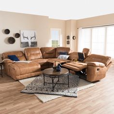 a living room filled with lots of furniture in it's centerpiece and wood flooring