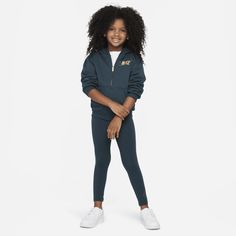 Kiddos can shine wherever they go in this 2-piece set. The hoodie is made of soft fleece for lightweight warmth, has slightly dropped shoulders create a relaxed fit, the full-zip closure makes layering easy and the matching leggings have a stretchy waistband for a comfy fit they can play freely in. Pair with any Nike tank or tee for a completed look. Nike Long Sleeve Sets For Winter, Nike Loungewear Sets For Winter, Nike Winter Loungewear Sets, Nike Long Sleeve Winter Sets, Casual Nike Winter Sets, Sporty Nike Winter Sets, Nike Sporty Winter Sets, Nike Hooded Tracksuit For Fall, Nike Hooded Winter Tracksuit