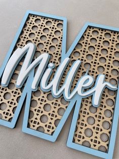 the word miller is cut out of wood