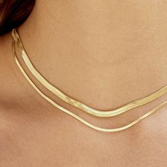 This Gorjana Venice Mini Necklace is a versatile piece of jewelry that can easily be layered for a unique look. Crafted with 18k gold-plated herringbone chain, its timeless design is sure to become a staple in your wardrobe. Total length 16" 1/16" wide chain Lobster closure Available in 18k gold plated brass Avoid contact with anything containing derivatives of alcohol Mini Necklace Gold, Mini Necklace, Bone Necklace, Herringbone Chain, Necklace Gold, Herringbone, Venice, Timeless Design, Bones