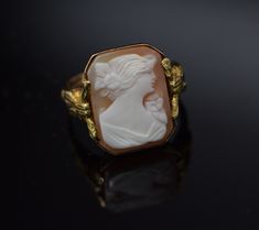 This is a 10K YG Cameo ring, Octagonal Shell cameo with decorations on sides, Circa 1930's, ring size 6, weight 3.5 grams, Nice vintge piece. Excellent condition. Stock #BB68R13 Collectible Art Deco Carved Jewelry, Art Deco Carved Collectible Jewelry, Victorian Yellow Gold Carved Rings, Victorian Carved Yellow Gold Rings, Vintage 14k Gold Cameo Rings, Antique Cameo Ring Collectible, Art Deco Cameo Ring For Collectors, Vintage Carved Yellow Gold Rings, Art Deco Cameo Ring Collectible