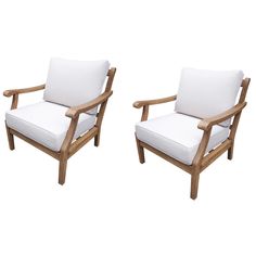 two wooden chairs with white cushions sitting next to each other