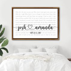 a bedroom with a white bed and a framed wall hanging above it that says, fresh amanda