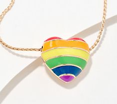 Show your support and share your beliefs with this heart-shaped pendant necklace on display. A colorful enameled rainbow radiates from one side of the heart, while the words Love Wins are proudly displayed on the other. From the Joan Rivers Classics Collection®. Rainbow Heart Charm Jewelry For Valentine's Day, Rainbow Heart Beads Jewelry, Rainbow Necklace With Heart Charm As Gift, Valentine's Day Multicolor Charm Necklaces, Rainbow Heart Pendant Jewelry Gift, Valentine's Day Multicolor Pendant Jewelry, Multicolor Heart Charm Jewelry For Anniversary, Multicolor Heart Pendant Jewelry For Mother's Day, Rainbow Heart Pendant Necklace For Gift