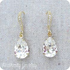 "Heatherly Designs dangling earrings made using genuine Swarovski® crystals in faux diamond which dangle from gold plated brass french earring hooks with tiny inlaid cubic zirconia. ●Nickel free ●Earring Size (L x W): 1.25\" x 1/2\" or 32 x 14mm ●Swarovski® crystal color name(s): Crystal ●Matching Necklace: http://etsy.me/1Og9wYm ●Arrives in our signature Heatherly gift box. Handmade with ❤ by Heather ● ● ● ● ● ● ● ● ● ● ● ● ● ● ● ● ● ● ● ● ● ● ● ● ● ● ● ● ● ● ● ● ● ● ● ● ● ● ● ● ● ●● ● ● ● ● ● Cubic Zirconia Bridal Earrings, Jewelry Portfolio, Swarovski Crystal Jewelry, Wedding Gold, Rose Gold Bridal, Nickel Free Earrings, Jewelry Wire, Jewelry Card, Swarovski Crystal Earrings