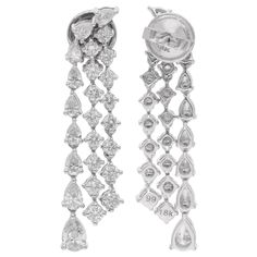 These exquisite chandelier earrings are crafted in 14 karat white gold and feature a captivating combination of pear-shaped and round diamonds with a total carat weight of 2.76 carats. The pear-shaped diamonds, known for their elegant and elongated silhouette, create a graceful and sophisticated design element. Item Code :- SEE-14444 (14k) Gross Wt. :- 6.46 gm 14k White Gold Wt. :- 5.90 gm Natural Diamond Wt. :- 2.76 Ct. ( AVERAGE DIAMOND CLARITY SI1-SI2 & COLOR H-I ) Earrings Size :- 34 mm appr Diamond White Pear-shaped Chandelier Earrings For Anniversary, Luxury White Gold Chandelier Earrings Pear-shaped, White Gold Diamond Chandelier Earrings Pear-shaped, Luxury Pear-shaped Diamond White Chandelier Earrings, Luxury Pear-shaped Diamond Chandelier Earrings, Diamond Chandelier, Diamond Chandelier Earrings, White Gold Jewelry, Pear Shaped Diamond