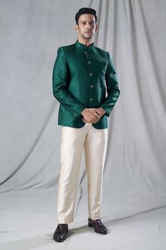 Green jodhpuri with all over floral butti pattern. Paired with a straight fit gold trouser. - Aza Fashions Fitted Green Bandhgala With Naqshi Detailing, Fitted Green Bandhgala With Naqshi, Green Formal Traditional Wear With Naqshi Embroidery, Formal Green Traditional Wear With Chikankari Embroidery, Green Naqshi Traditional Wear For Formal Occasions, Formal Green Traditional Wear With Naqshi Detailing, Formal Green Traditional Wear With Naqshi, Festive Green Bandhgala With Naqshi Detailing, Festive Green Bandhgala With Naqshi