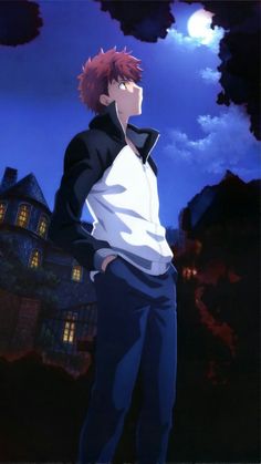 a man with red hair standing in front of a house at night, looking off into the distance