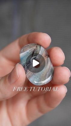 a person holding a crystal stone in their hand with the text free video on it