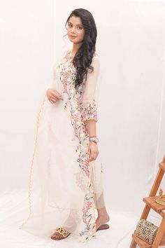 White sheer kurta with thread embroidered floral motifs, pearl embellishments and scalloped borders. Comes with culottes, undershirt and dupatta. - Aza Fashions Semi-stitched Traditional Wear With V-neck, Semi-stitched Traditional V-neck Wear, Traditional Semi-stitched V-neck Wear, V-neck Salwar Kameez With Dabka Work For Wedding, Chanderi V-neck Sets For Wedding, V-neck Dabka Work Salwar Kameez For Wedding, Semi-stitched V-neck Traditional Wear For Diwali, V-neck Chanderi Sets For Wedding, Traditional Georgette V-neck Kurta