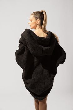 When temps drop, you cocoon up. Designed with a luxe faux sherpa fabric, the Cocoon Coat makes layering a breeze (ironic, right?). Pair with your go-to jeans or workout ootd. Oversized Cozy Fur Coat For Fall, Black Sherpa Outerwear, Oversized Black Sweater Coat For Loungewear, Oversized Cozy Fur Coat For Cold Weather, Cozy Oversized Black Outerwear, Black Winter Sweater Coat For Loungewear, Black Sweater Coat For Winter Loungewear, Oversized Loungewear Outerwear With Fleece Lining, Cozy Fit Black Outerwear For Loungewear