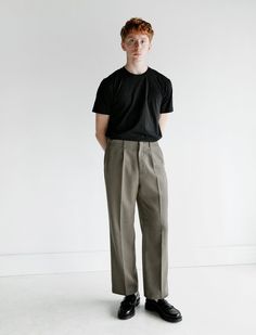 A staple from the brand our legacy's borrowed chino returns in portugese olive hunting wool. this wide legged trouser has a relaxed fit boasting a front pleat and four pockets.    - made in portugal  - 55% polyester 45% wool  - dry clean only  - relaxed fit  - zenon is 6'3" 170 lbs. and wears size 48 / m Classic Relaxed Fit Wide-leg Chinos, Monochrome Outfit Men, Relaxed Fit High-waisted Chinos With Pockets, Pleated Pants Outfit, Olive Relaxed Fit Trousers, Mid-rise Relaxed Fit Chinos With Pockets, Our Legacy Menswear, Trousers Outfit Men, Wide Leg Trousers Outfit