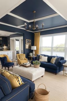 a living room with blue walls and yellow accents on the ceiling, two couches in front of a fireplace