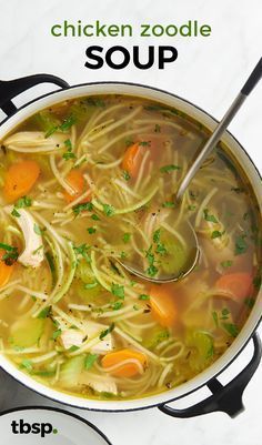 chicken zoodle soup in a pot with a spoon