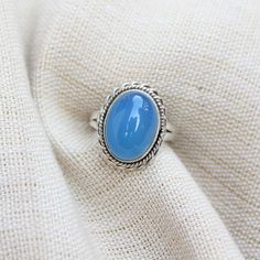 Gemstone - Blue Chalcedony Gemstone size - 12x16 mm oval shape Metal - Sterling Silver Ring Size- All sizes available Each Ring made with Precision and love, these rings are perfect for everyday use and a perfect accessory to wear at work. Rings can be customized on request and gemstone can be switched to any other as per requirement. kindly visit my store to view the complete collection. Feel free to contact me for any queries regarding jewelry or for bulk order. The ring will be gift wrapped i Oval Turquoise Moonstone Ring, Blue Oval Opal Ring Gift, Blue Oval Cabochon Opal Ring, Blue Moonstone Birthstone Ring, Oval Blue Cabochon Gemstones, Blue Oval Cabochon Gemstones, Oval Blue Cabochon Rings, Adjustable Blue Moonstone Ring With Cabochon, Adjustable Blue Moonstone Cabochon Ring