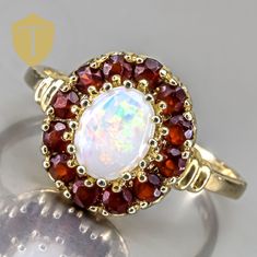 This vintage 14K gold ring showcases a stunning opal that radiates vibrant hues, making it a true statement piece. Weighing 3.2g and sized at 8.5, it features an approximate finger coverage of 13.5mm and a rise of 5.5mm, creating an elegant silhouette on the hand. Marked with "14k" and in great condition, this ring beautifully blends classic charm with the captivating allure of opal, perfect for those who appreciate unique and timeless jewelry. Karat: 14K Weight: 3.2 g Size: 8.5 Approximate measurement: coverage: 13.5 / Rise: 5.5 Stone(Approx. Size):  Opal Markings: 14k  Condition: Great Approx Era: Vintage DELIVERY Our shipping and handling is always fast & free unless otherwise stated. Once an order is placed and payment is received, all items are shipped within one business day, excludi Christmas Deals, Timeless Jewelry, 14k Gold Ring, Vintage Ring, Rings Statement, Gold Ring, Women Rings, Statement Rings, Gold Rings