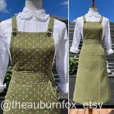 This overalls dress is simply adorable!  The great thing is, you can wear a blouse, t-shirt, or tank underneath.  The dress is done in a quilted olive green with pink & white rosebuds.  Two buttons for the shoulder straps, so they are adjustable.  Two front pockets.  Zips up to waist in the back.  Some things to note....pic 8 shows some loose thread.  Pic 9 shows a hole near side seam of skirt. Measurements: Open bust  Waist 26" Length 43-44" (adjustable straps) **BUYER IS RESPONSIBLE FOR REVIEW Fitted Cotton Casual Pinafore Dress, Fitted Cotton Pinafore Dress Casual Style, Cotton Cottagecore Pinafore Dress, Spring Cotton Fitted Pinafore Dress, Fitted Cotton Pinafore Dress For Spring, Fitted Cotton Pinafore Dress For Fall, Vintage Fitted Pinafore Dress For Spring, Vintage Cotton Pinafore Dress For Spring, Quilted Overalls