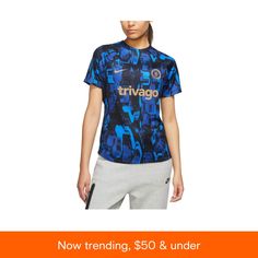 a woman wearing a blue shirt and shorts with the words, now trending $ 50 & under