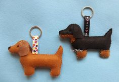 two keychains made to look like dogs