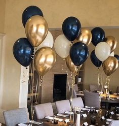 the table is set with black and white balloons