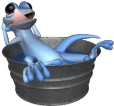 a cartoon frog sitting in a bath tub