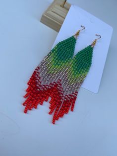 Boho Ombré Seed Bead Fringe Earrings with Crystals  Beautiful boho fringe earrings in stunning ombré shades . These seed beads , statement earrings are individually hand woven from tiny Japanese  miyuki seed beads. Shoulder skimming and very lightweight, they will add a touch of bohemian chic to any outfit. As all jewellery is handmade, slight variations to the product in the image may occur. Seed bead earrings are made to order so please allow up to 2 days for dispatch. - Ear wires: hypoallergenic earring hooks-nickel free.  - seed beads - CARE INSTRUCTIONS - The colour on gold plated jewellery may fade over time if it is not properly taken care of. To ensure it stays in perfect condition: 1. Remove it before coming into contact with water (e.g. swimming, exercising, showering), or using Bohemian Christmas Jewelry, Bohemian Christmas Dangle Earrings, Native Beaded Earrings, Crystals Beautiful, Bead Fringe, Red Fringe, Boho Fringe, Earrings Christmas, Gift For Her Birthday