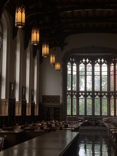 the inside of a building with tables and windows