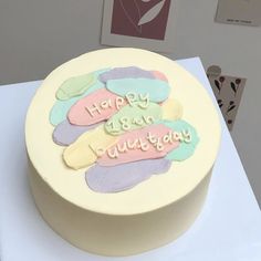 a birthday cake with frosting and writing on it