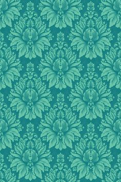 a blue and green wallpaper with large leaves on the back ground, in an ornate pattern