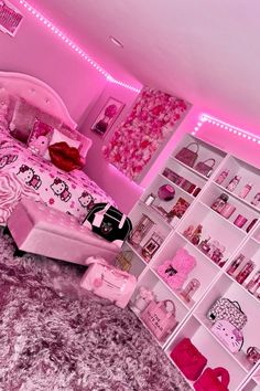 a bedroom decorated in pink and white with hello kitty decorations