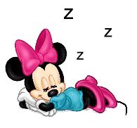 a minnie mouse with a pink bow on her head and blue pants, laying down