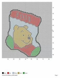 a cross stitch christmas stocking with a teddy bear on it