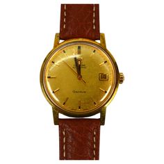 Smart looking with casual flair, this vintage Omega 565 Men's Automatic Wrist Watch with Date has a 245 quick set 17 jewel automatic movement. Circa 1960's, in size 33mm, this fine vintage Omega has a gold-toned face with matchstick numerals. A fresh saddle brown leather strap has been installed. Gift Boxed. Toned Face, Swatch Omega Jupiter, Omega Planet Ocean 39.5, Omega Watch Vintage, Omega 2254.50, Vintage Omega, Apollo 11, Saddle Brown, Brown Leather Strap