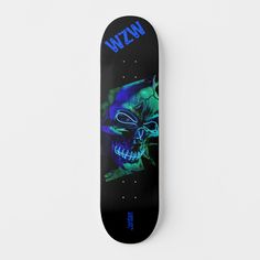 a black skateboard with a blue skull on it's bottom and the words wizard above it