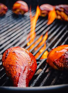 two hot dogs are being grilled on the grill