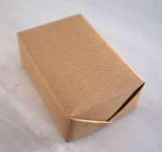 a brown box sitting on top of a white table