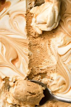 a scoop of ice cream sitting on top of a metal spoon