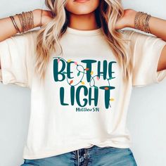 Be the Light | Christian Christmas Shirts | Christian T-Shirts | Bella Canvas T-Shirts | Christmas Bella Canvas | Be the Light Shirt * 100% combed and ring-spun cotton (Heather colors contain polyester) * Fabric weight: 4.2 oz./yd.² (142 g/m²) * Pre-shrunk fabric * Side-seamed construction * Shoulder-to-shoulder taping * Blank product sourced from Nicaragua, Mexico, Honduras, or the US This product is made especially for you as soon as you place an order, which is why it takes us a bit longer to Be The Light Tshirt Designs, Be The Light Shirt, Let Your Light Shine Shirt, White Relaxed Fit T-shirt For Christmas, White Relaxed Fit Christmas T-shirt, Christian Christmas, Nicaragua, Honduras, Christian Shirts