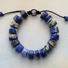 Not only does the Handmade Sodalite Stone Bead Bracelet look great and make the perfect gift for someone. Sodalite brings order and calmness to the mind and is an excellent stone for anyone on the path for truth and discovery. Called the Logic Stone, it inspires awakening, deep thought and helps to clear the mind. It promotes Confidence, Communication and Creativity. It benefits the Throat Chakra with communication and expression of creativity - feeling comfortable to express your feelings - Art Adjustable Sodalite Beaded Bracelets With 8mm Beads, Spiritual Lapis Lazuli Beaded Bracelet With Natural Stones, Adjustable Lapis Lazuli Gemstone Beaded Bracelets, Healing Lapis Lazuli Beaded Bracelets With Natural Stones, Adjustable Lapis Lazuli Beaded Bracelets For Meditation, Sodalite Round Beads Bracelets For Healing, Spiritual Sodalite Gemstone Beaded Bracelets, Sodalite Beaded Bracelets With Natural Stones For Gift, Adjustable Sodalite Gemstone Beaded Bracelets