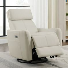 a white recliner chair sitting on top of a rug