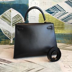 Description HRMS Kelly 28 Black Bag With Gold Toned Harware For Women, Handbags, Shoulder Bags 11in/28cm Rep 1:1 Size: 28 x 22 x 10 cm / 11 x 8.5 x 4.5 inches (Length x Height x Width) Hermès bags are considered the ultimate luxury item worldwide. Each piece is handcrafted with waitlists that can exceed a year or more. The streamlined and demure Kelly style is always in high demand, it is particularly lovely in this vibrant version with gold hardware. Epsom is textured with a wonderful grainy ap Hermes Kelly 28 Black, Kelly 28 Black, Hermes Kelly 28, Togo Leather, Stylish Handbags, Orange Leather, Hermes Bags, Evening Clutch Bag, Black Bag