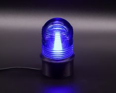 a blue light sitting on top of a table