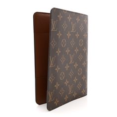 This is an authentic LOUIS VUITTON Monogram Desk Agenda Cover. This agenda cover is crafted of classic Louis Vuitton monogram on coated toile canvas. This cover opens to a terra cotta cross grain leather interior with patch pockets and card slots. Agenda Cover, Terra Cotta, Leather Interior, Authentic Louis Vuitton, Louis Vuitton Monogram, Patch Pocket, Card Slots, Slots, Grain