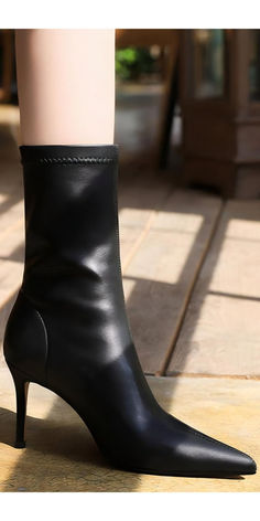 Step into elegance with these sleek black high-heeled boots. Perfect for any occasion, these ankle boots feature a 3-inch heel and a 10.6-inch total height. Ideal for both professional and casual settings, they offer a chic and streamlined look. Shop now and elevate your style effortlessly with our versatile and durable boots.