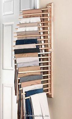 a rack with pants hanging from it's sides