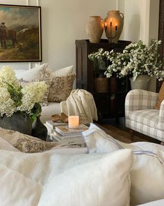 a living room filled with furniture and flowers