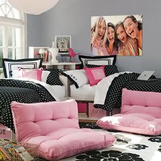 a living room with pink and black furniture