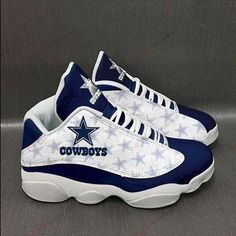 a pair of sneakers with the word cowboys on them