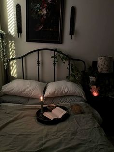 a lit candle sits on top of a bed